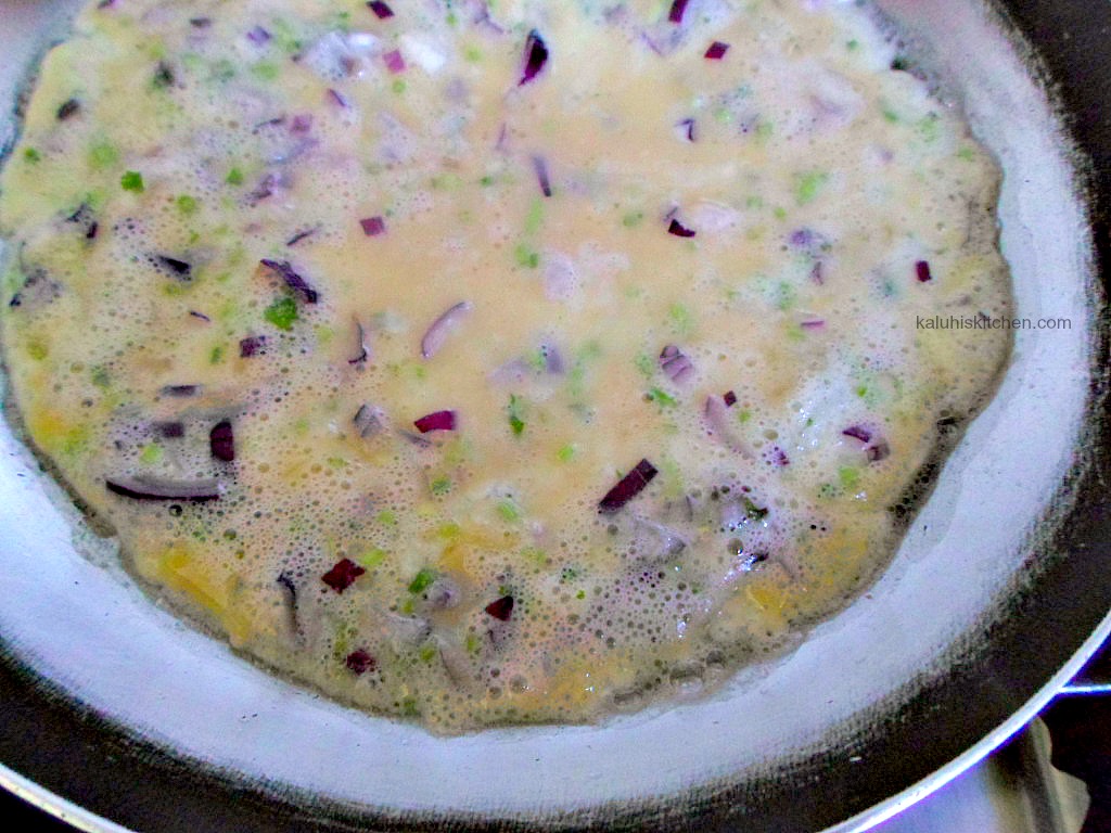 onion omelete frying in pan