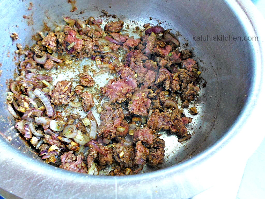 adding minced beef to sauteed onions