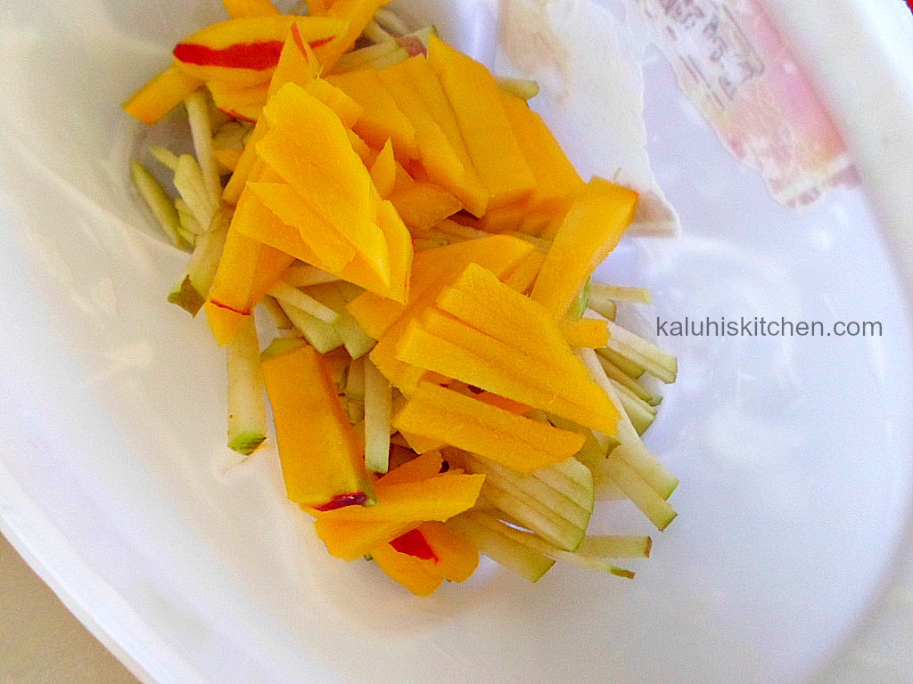 apples and mangoes for coleslaw in a container