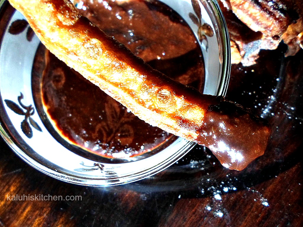 churros dipped in chocolate sauce