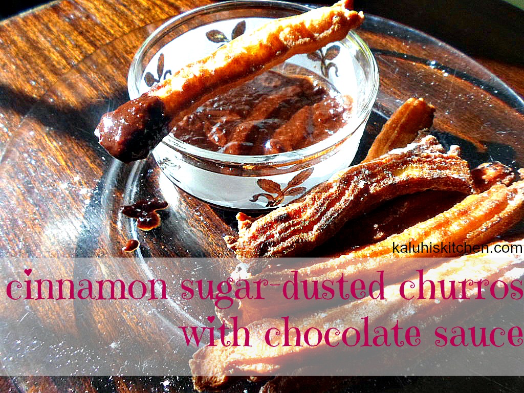 cinnamon sugar dusted churros with chocolate sauce