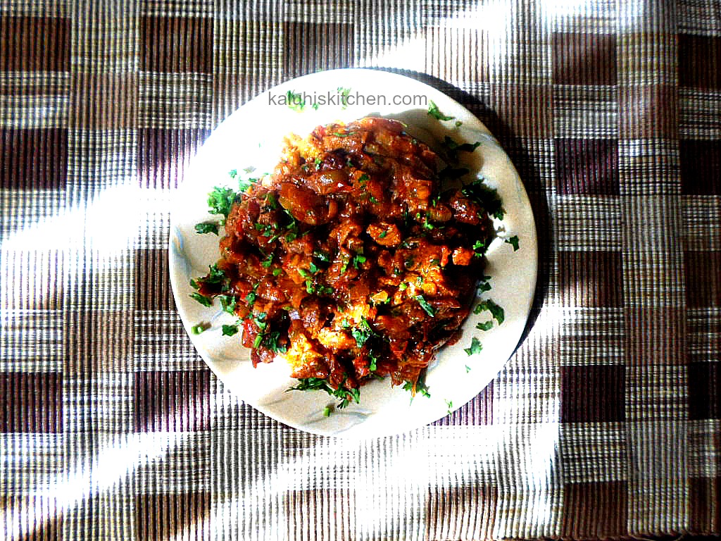 dry fry goat meat with coriander garnish