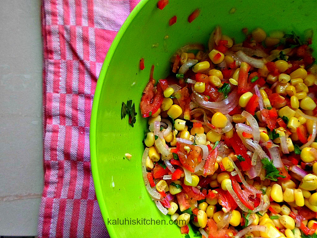kachumbari salad_adding sweet corn to kachumbari_kenyan food_sweet corn and tomato salad
