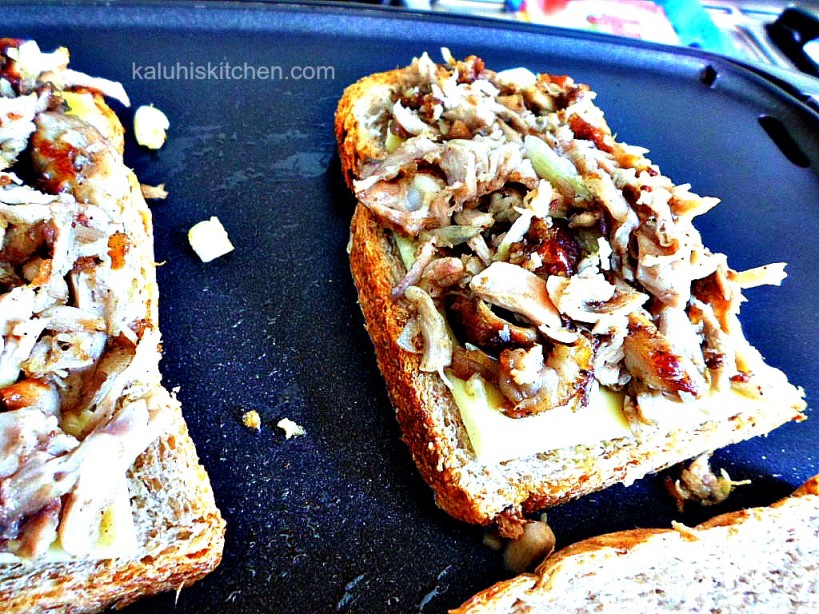 assembling a grilled cheese burger_put the cheese first at the bottom so that it can melt followed by the shredded chicken