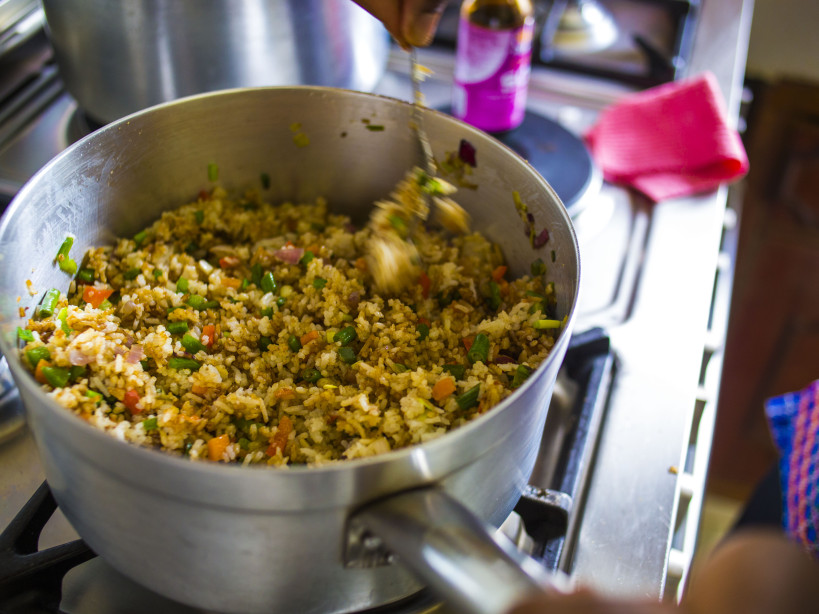 mixing cooked rice into french beans and carrots_vegetable fried rice_Kenyan food blogs_healthy woman magazine interview of Kaluhi Adagala