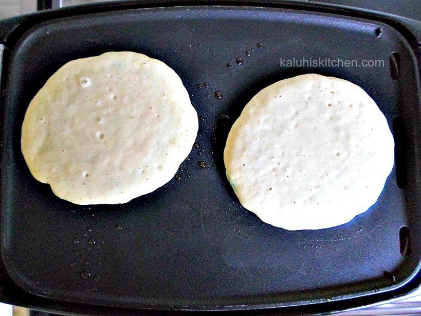 orange zest funfetti pancakes simmeering on low heat to get the perfect browness_Kaluhis Kitchen