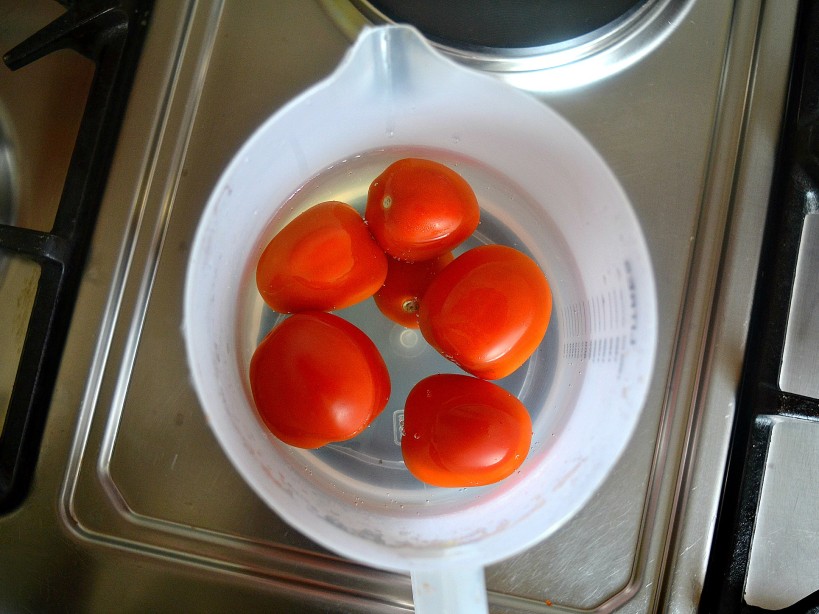 SOAKING TOMATOES IN HOT WATER PEELS AWAY HE SKIN INSTANTLY MAKING COOKING EASIER_TOMATO SOUP BY kaluhiskitchen.com