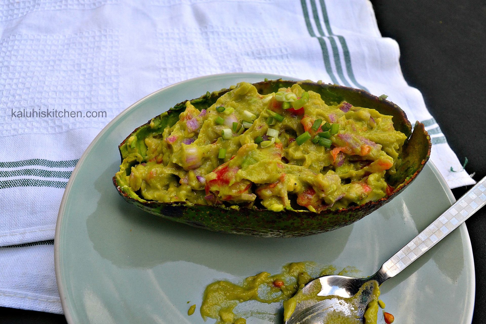 www.kaluhiskitchen.com presents the best guacamole recipe with lime, garlic, and red onion
