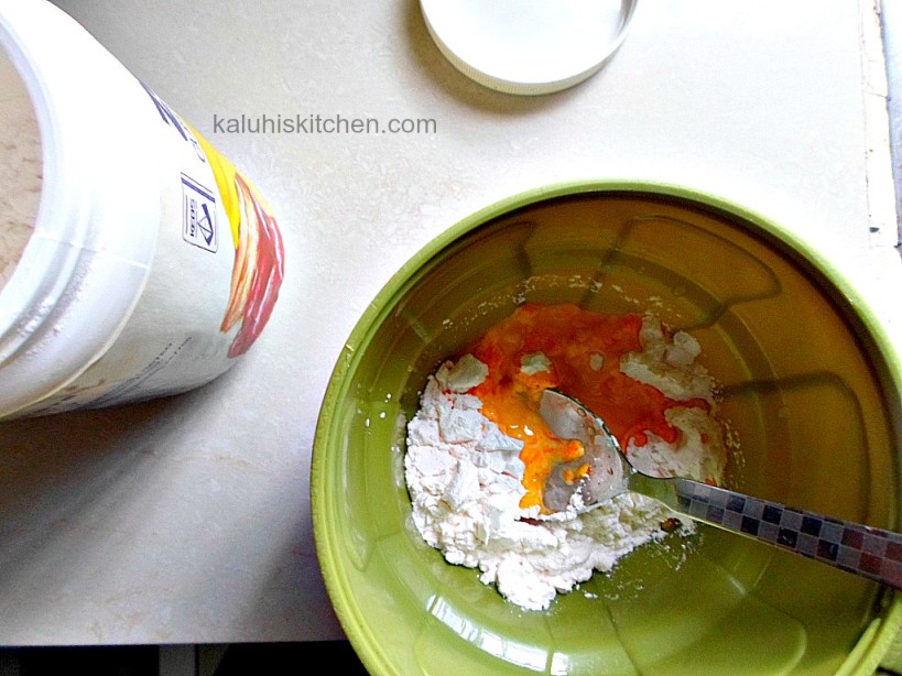 mixing up custard powder into a paste to before adding it to the milk_Kenyan dessert