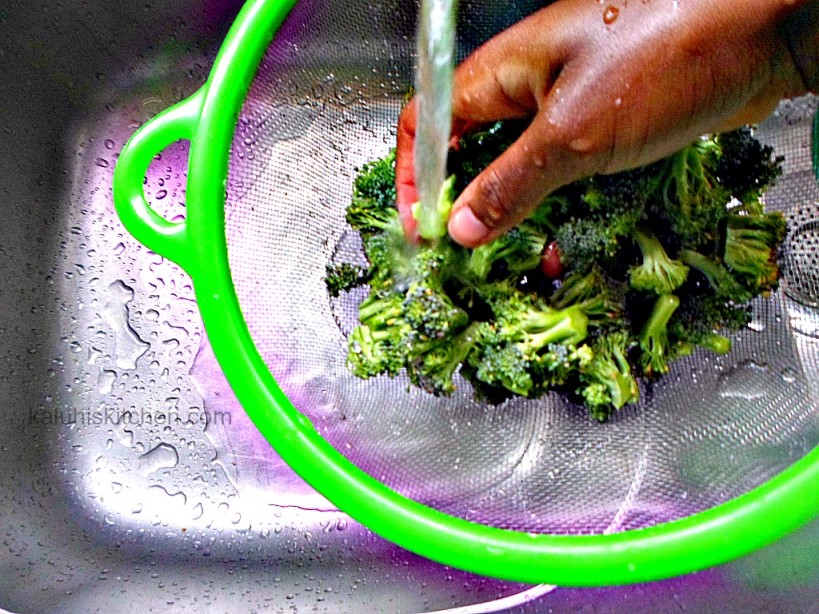 washing broccoli before cooking with them as demonstrated by Kaluhi Adagala of kaluhiskitchen.com