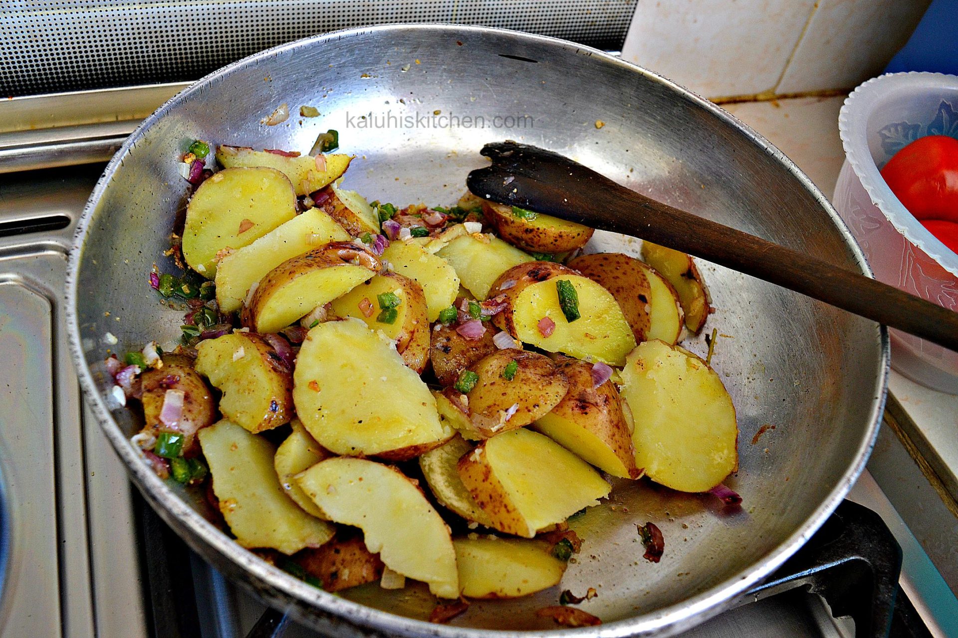 tossing the potatoes in the sauteed vegetables allow everything to mix well without them getting smashed up in the process_kaluhiskitchen.com