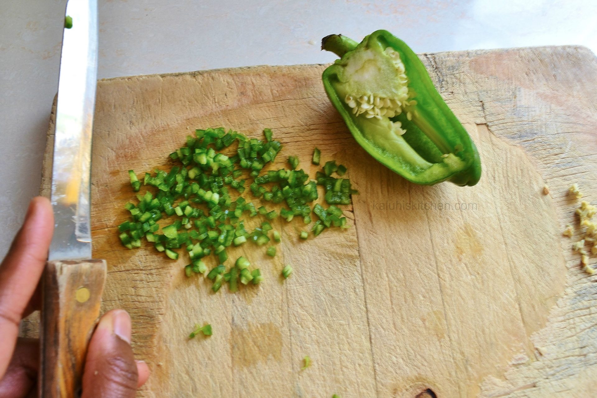always finely chop your green bell pepper so that whisking is easy and the omelette is delicious_kaluhiskitchen.com