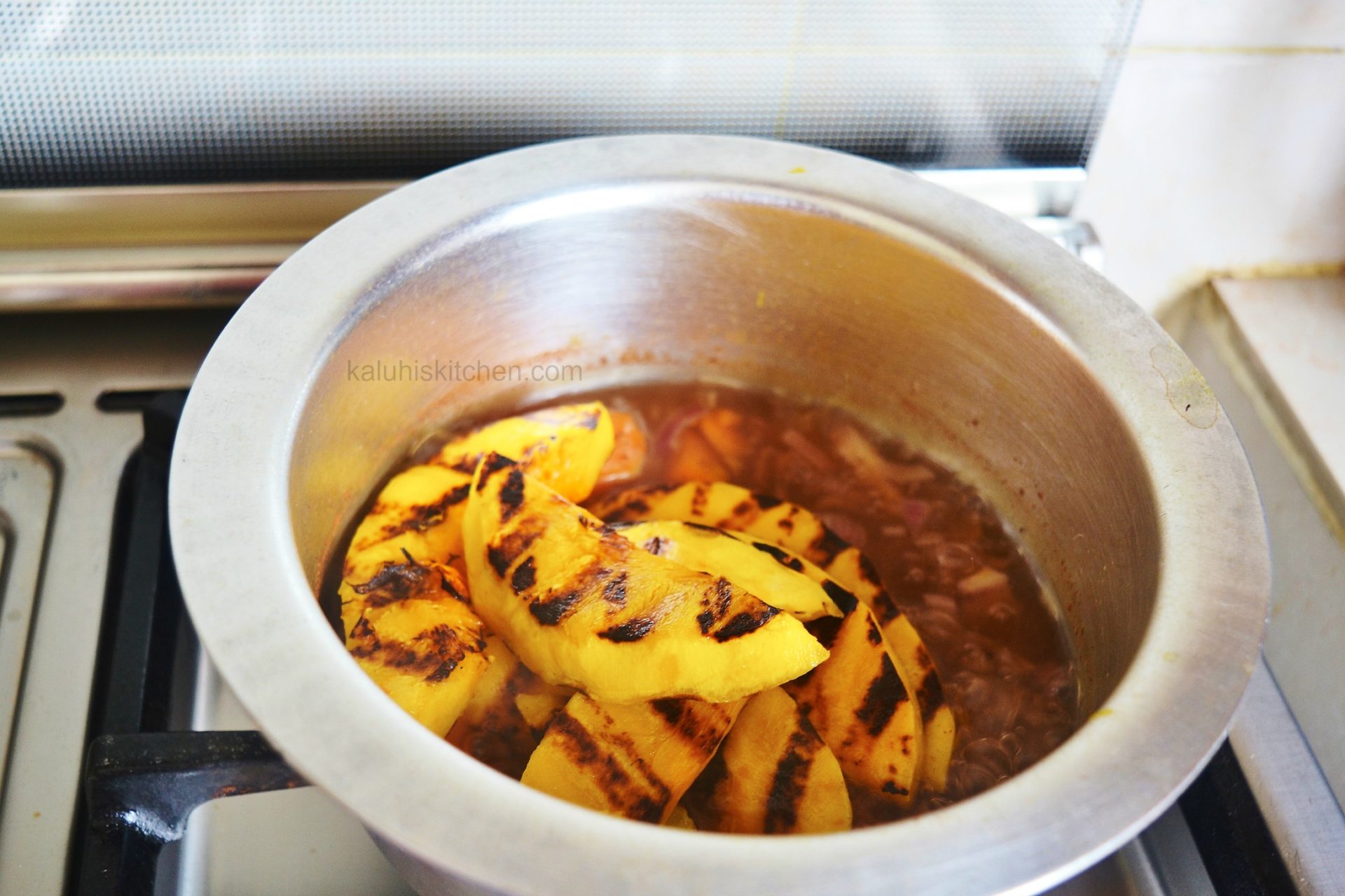 befor you add the grilled pumpkin,boil the carrots until tender with some onion and cinnamon for the pumpkin soup_kaluhiskitchen.com