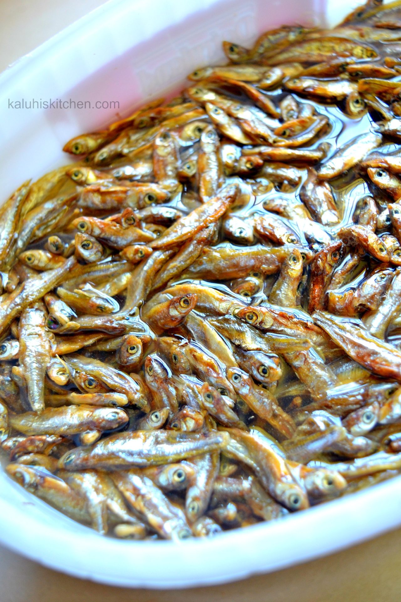 soak omena in hot water together with apple cider vinegar makes them alot more tender and elivated the smell that this kind of fish inherently has_kaluhiskitchen.com