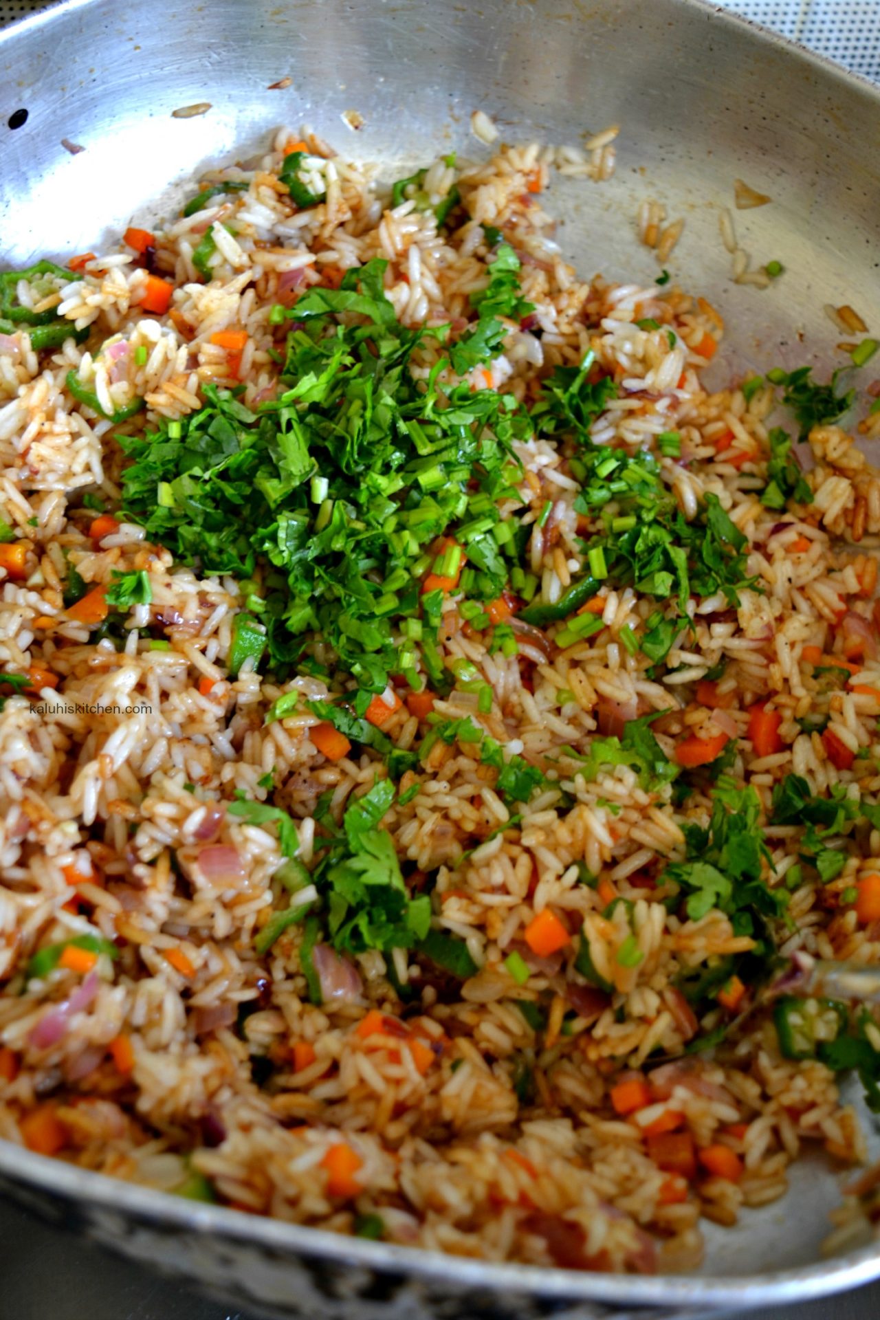 add the coriander towards the ende so that it still retains its vibrant green in the rosemary and okra fried rice_kaluhiskitchen.com