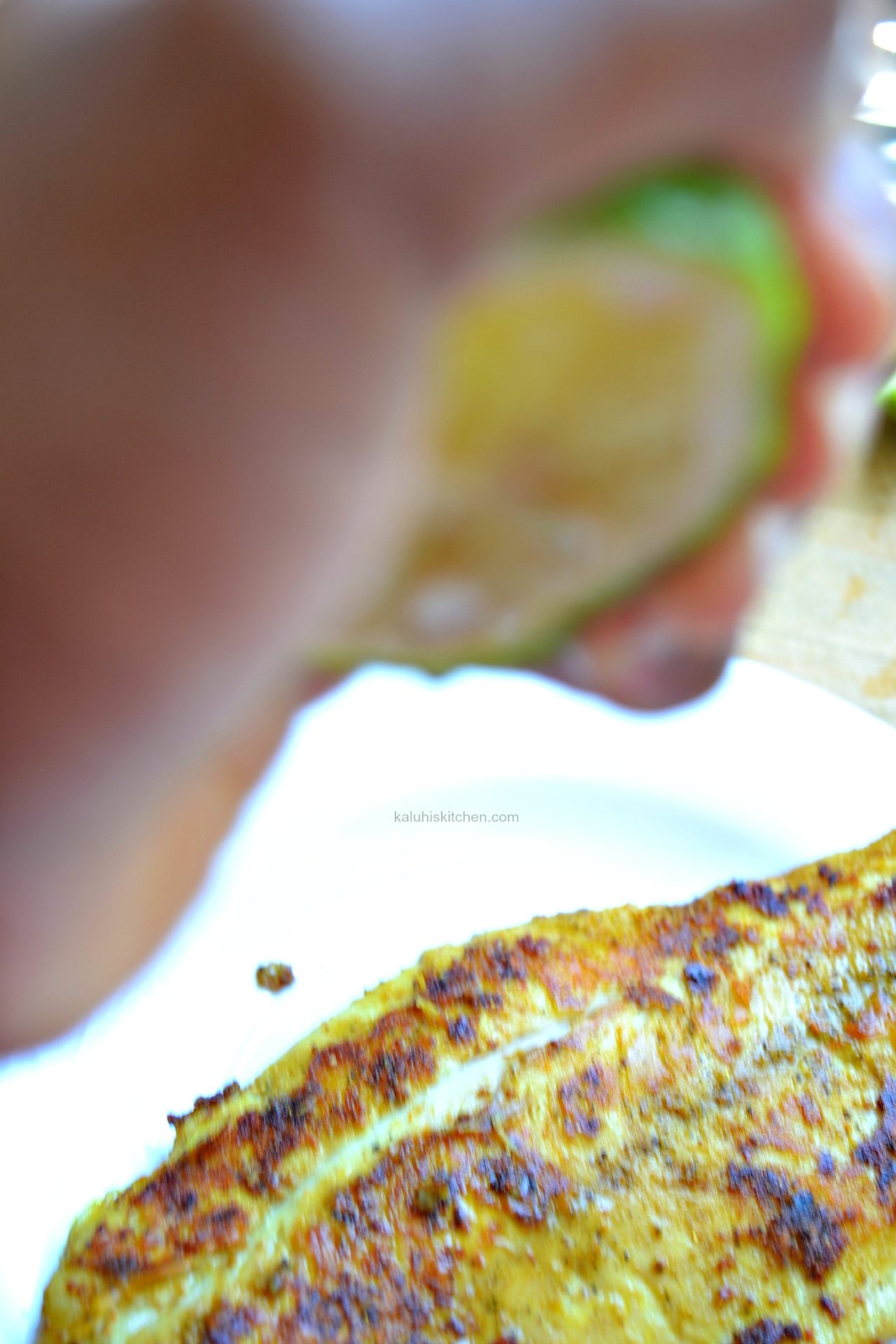 After the fish is done, squeeze a generous spritz of lemon juice over it and allow it to soak on and serve the fish masala_kaluhiskitchen.com