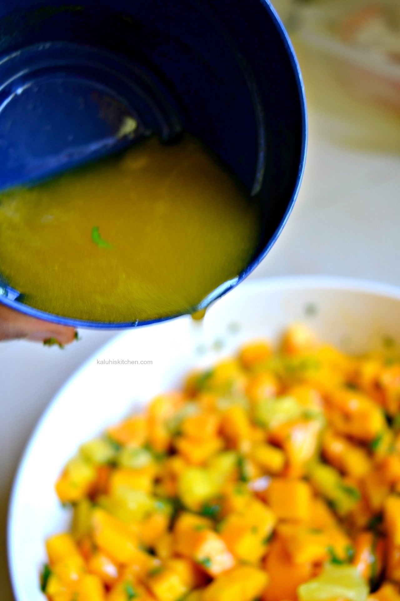 add the passion fruit syrup to the salad after it has cooled down and toss it all together_kaluhiskitchen.com_mango mint salad