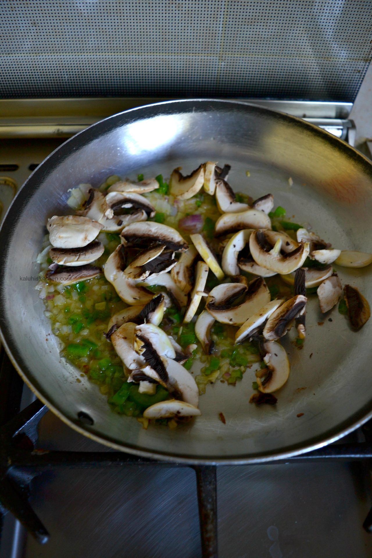 cook the mushrooms together with the green bell pepper and red onion until they have just softened_kaluhiskitchen.com