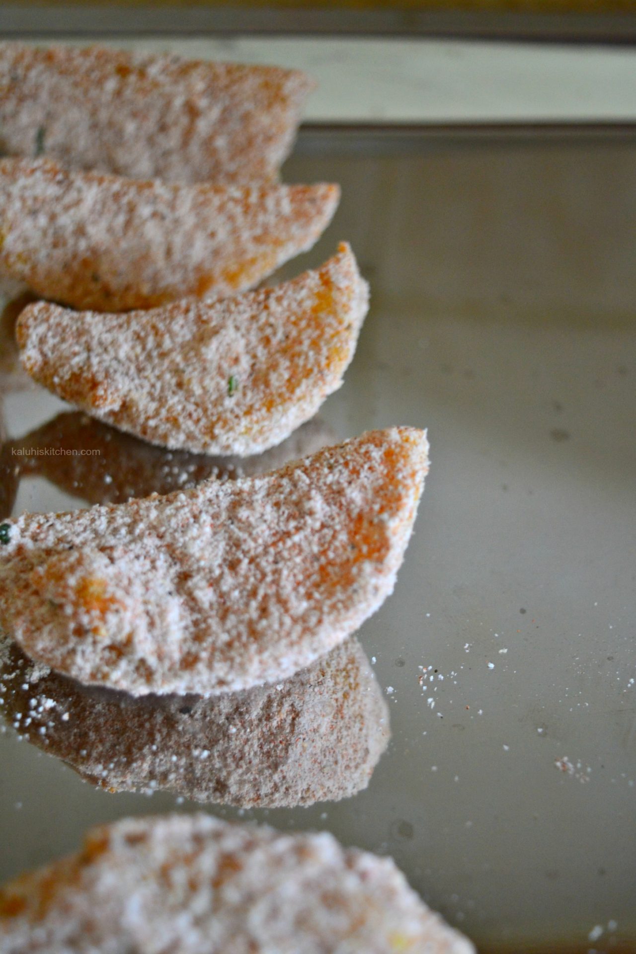 coat the rosemary potato wedges in the flour and then set aside_kaluhiskitchen.com