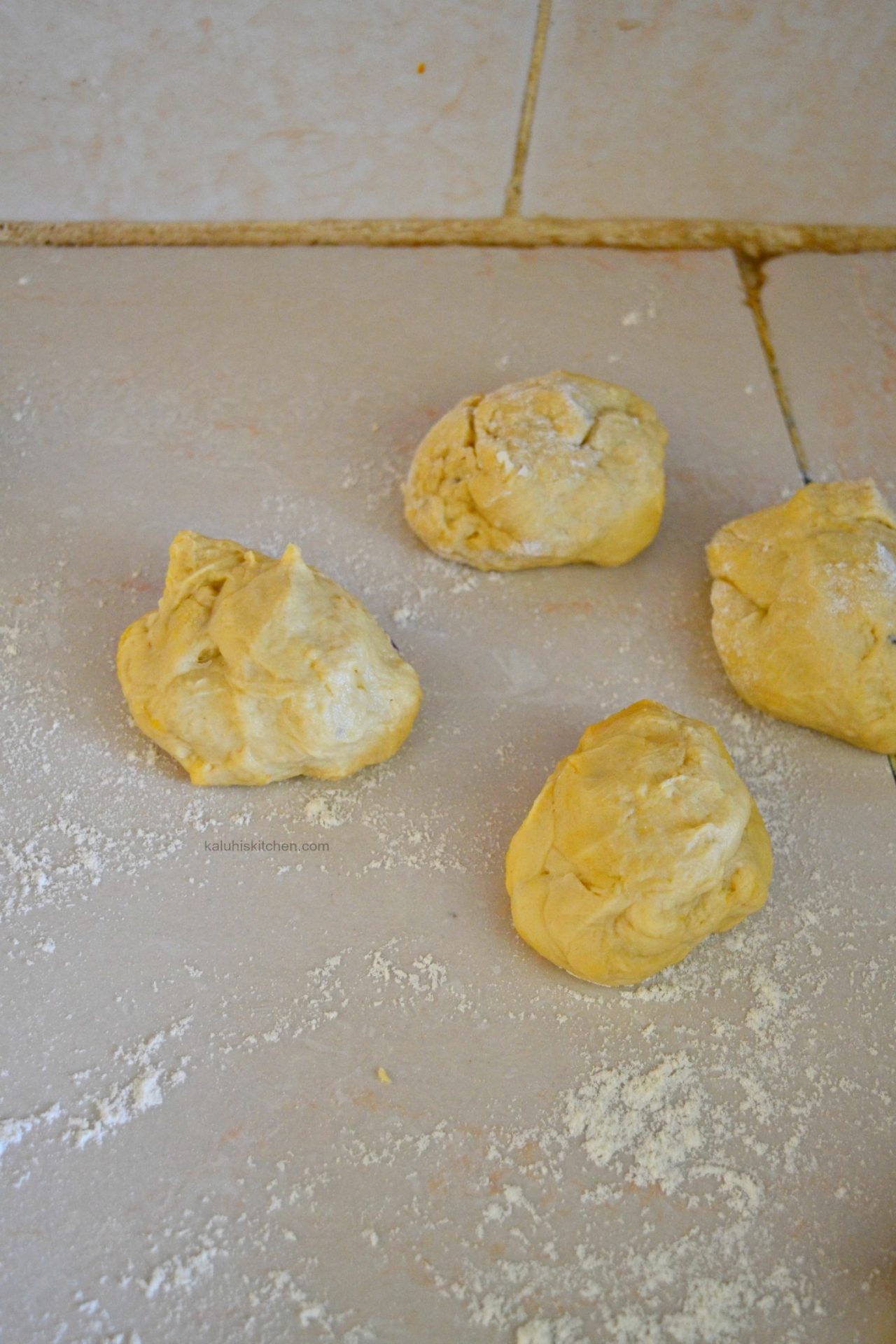first step in rolling out your chapati dough is dividing the dough into tangerine-sized dough balls_how to make chapati_kenyan food recipes_kaluhiskitchen.com