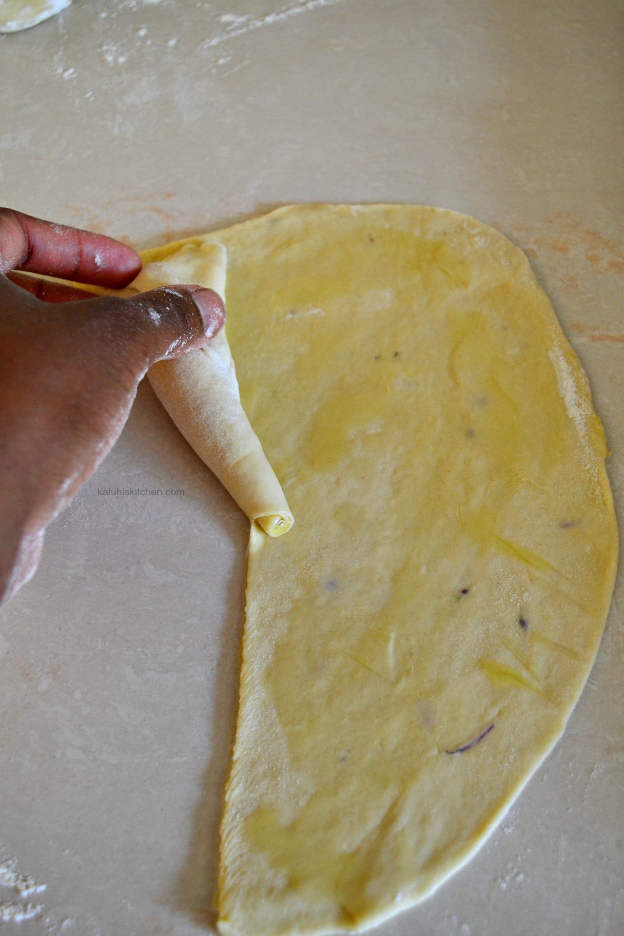 roll the chapati until it forms a cone_how to make chapati_how to roll chapati_kaluhiskitchen.com