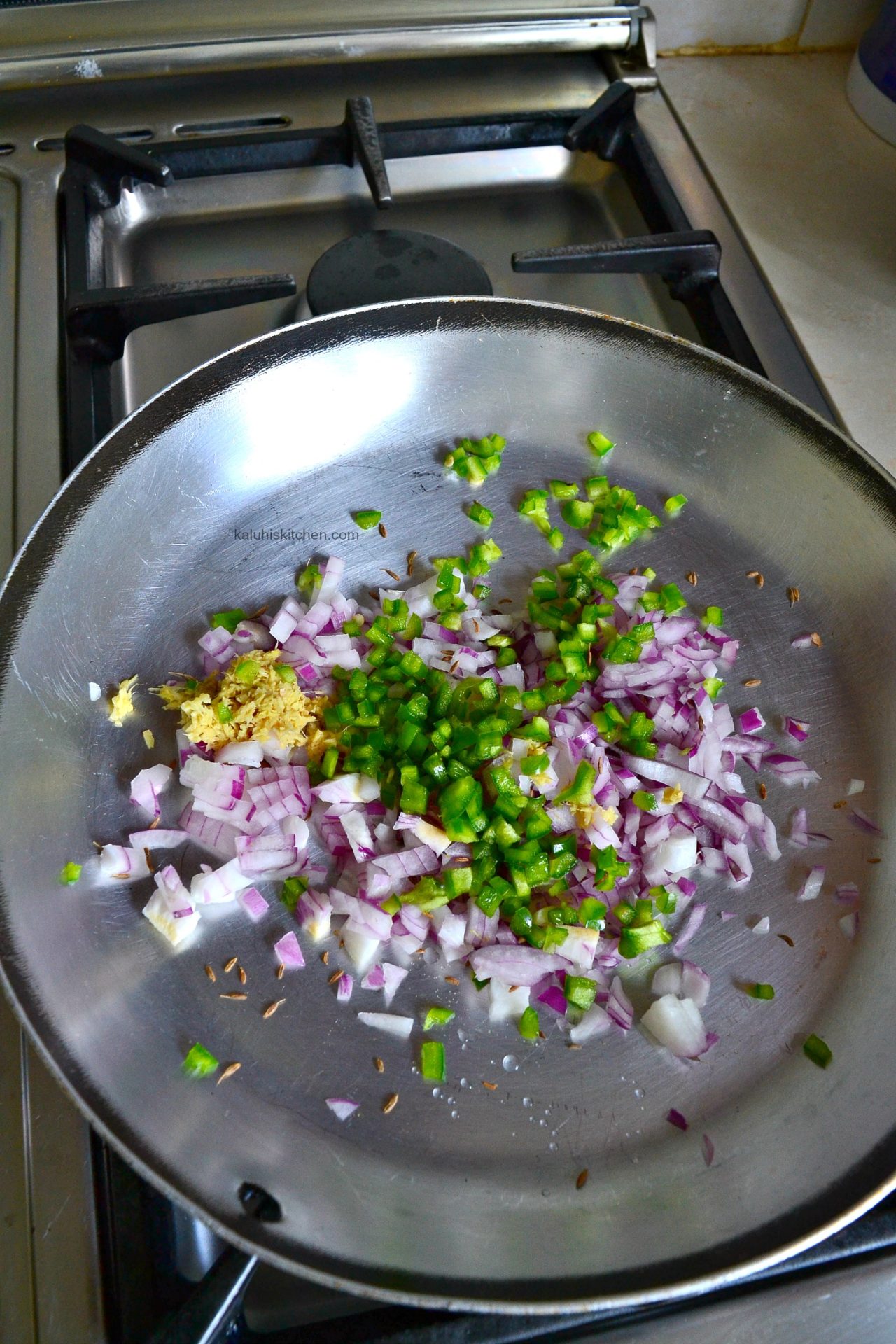 the first step of preparing your masala is by frying your red onion, hoho , whole cumin seeds and minced ginger_matoke recipes_kenyan food recipes