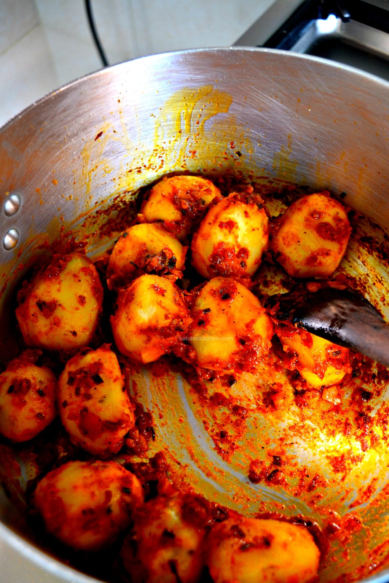 add the potatoes into the cookes tomato sauce and let it somme in it for about 5 minutes before serving_kaluhiskitchen.com