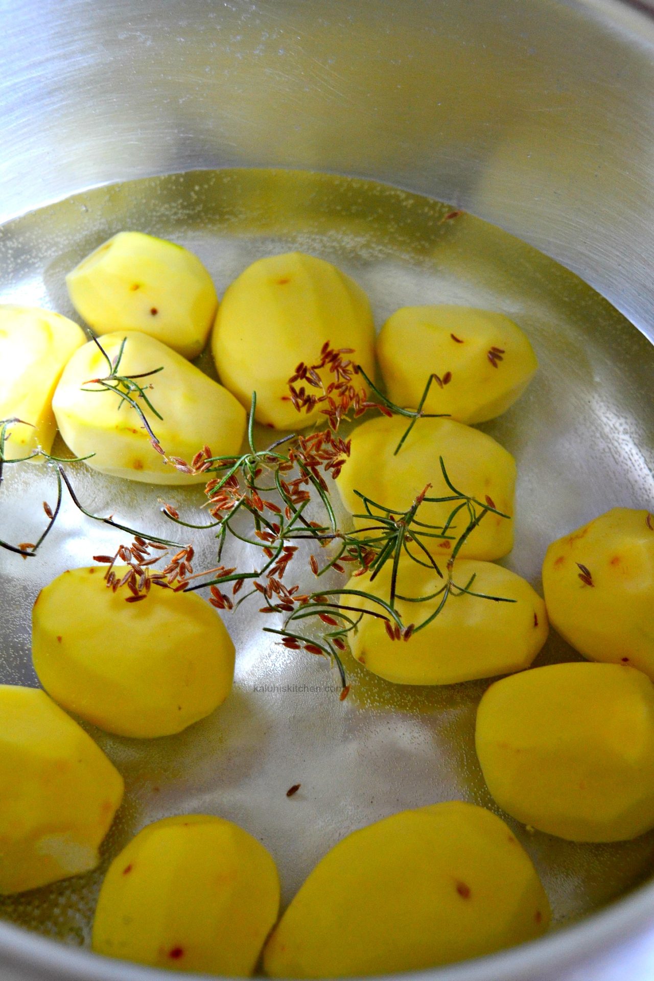 boil your potatoes with some cumin seeds and rosemary for all the flavor to deeply infuse_kaluhiskitchen.com