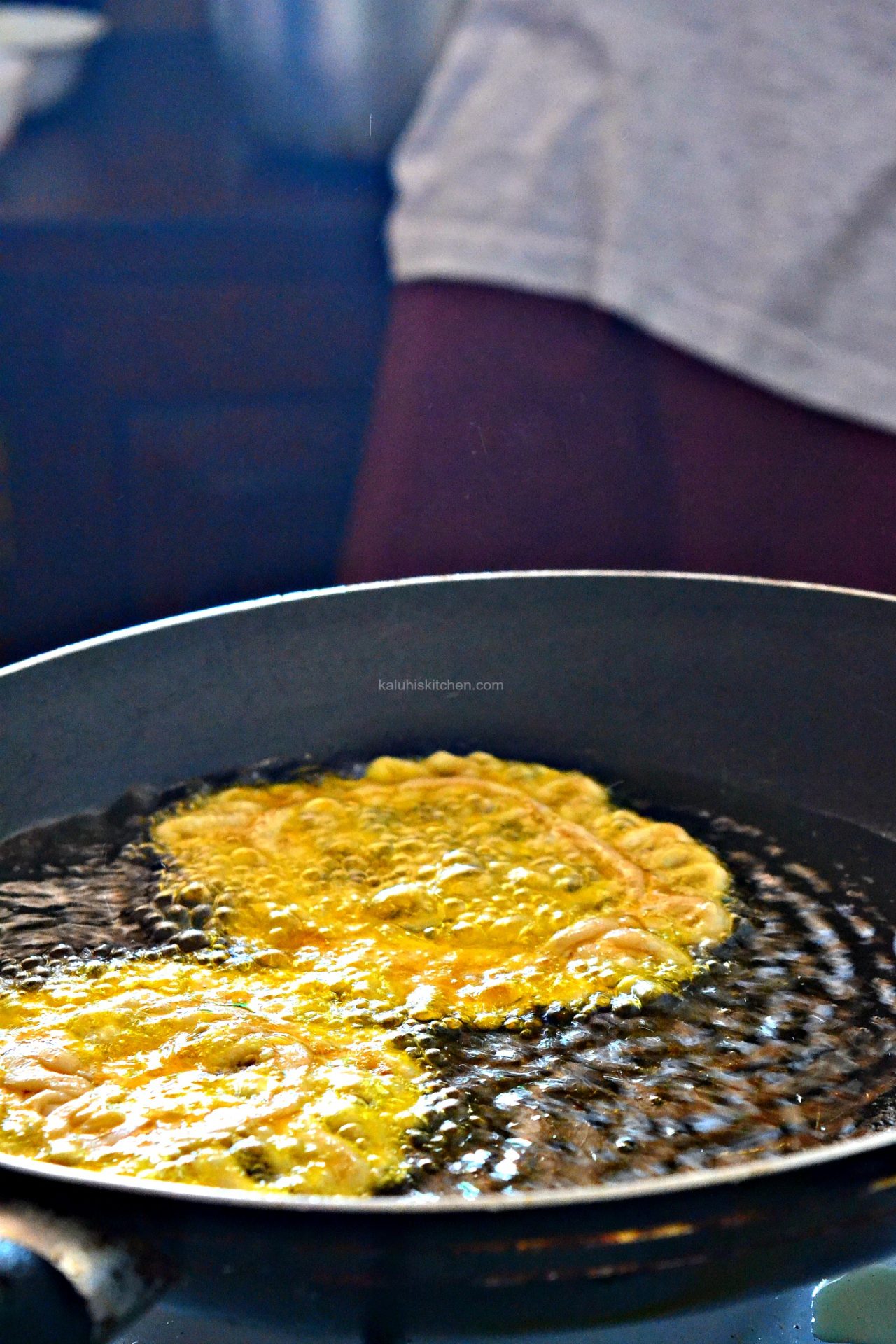 fry the mkate wa mkono for about 5 minutes on each side until they turn golden brown_remove from the heat and serve_kaluhiskitchen.com