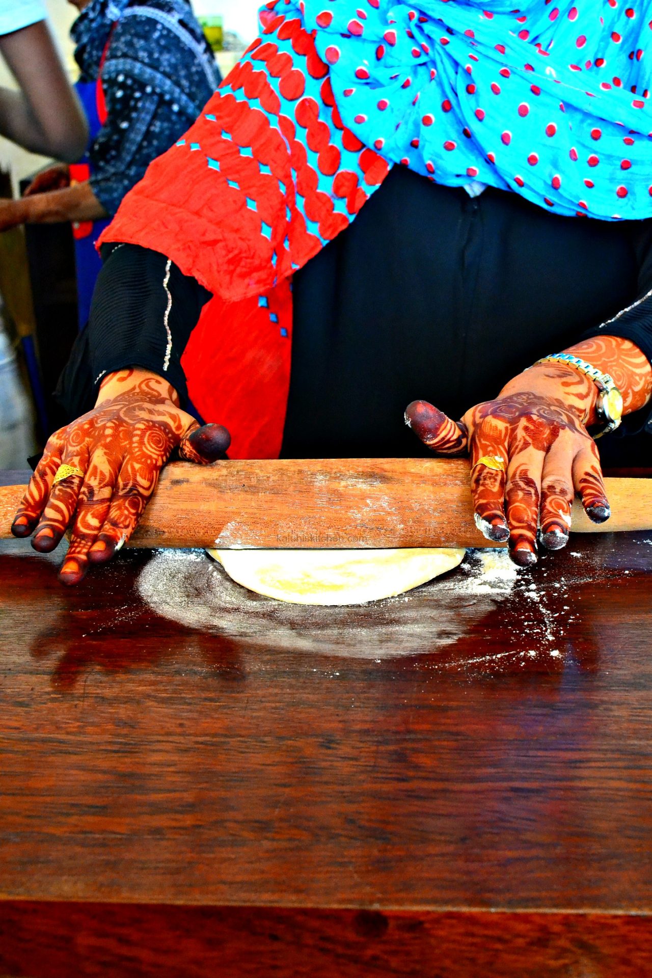 roll out the dough of the swahili pizza until its circular and thin_makaku ya kulisha_how to make swahili pizza_kaluhiskitchen.com