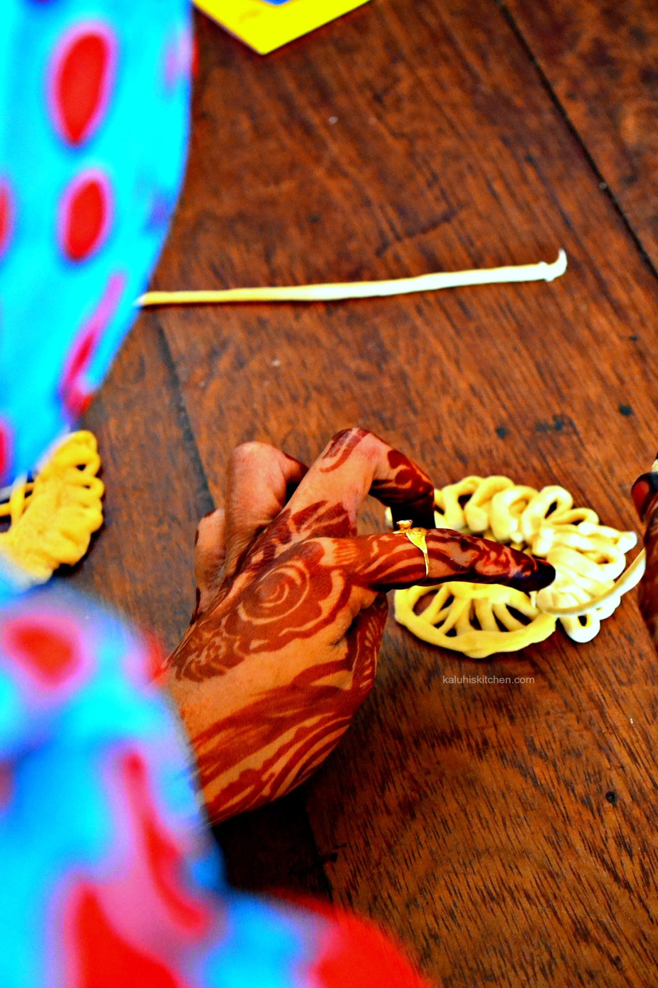 roll the dough strips into any shape you want. the lamu ladies usually create very detailed, intricate shapes with their dough and this is served at wedidngs_lamu food festival