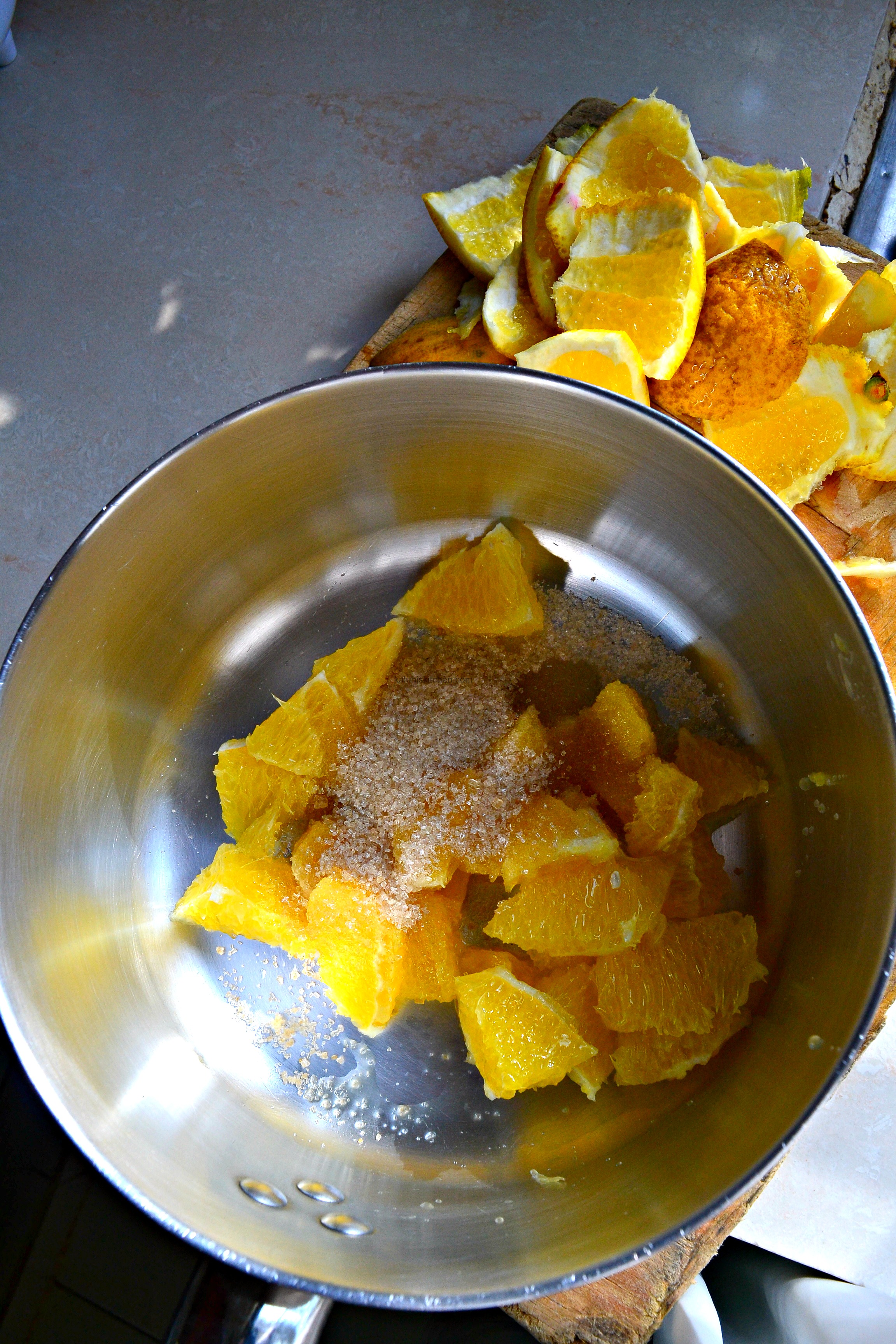 to make the orange compote, add some sugar to a pot and allow this to simmer for about 10 min until it softens and thickens-Kaluhiskitchen.com