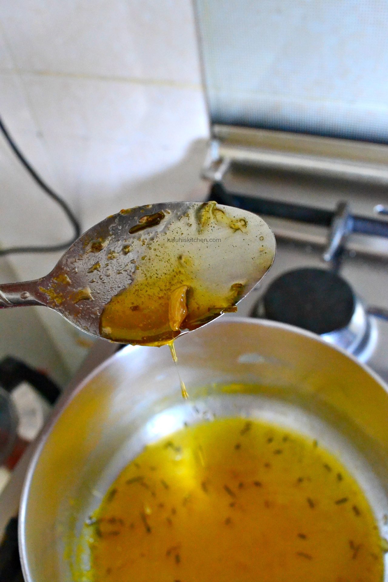 when your orange syrup is done, it should have the same consistency as honey_how to make orange syrup_kaluhiskitchen.com