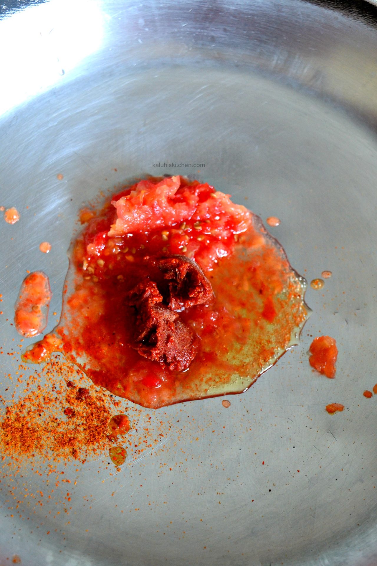 cook down your base with tomatoes, tomato paste, cayenne and some whiskey to infuse more flavor to it_kaluhiskitchen.com