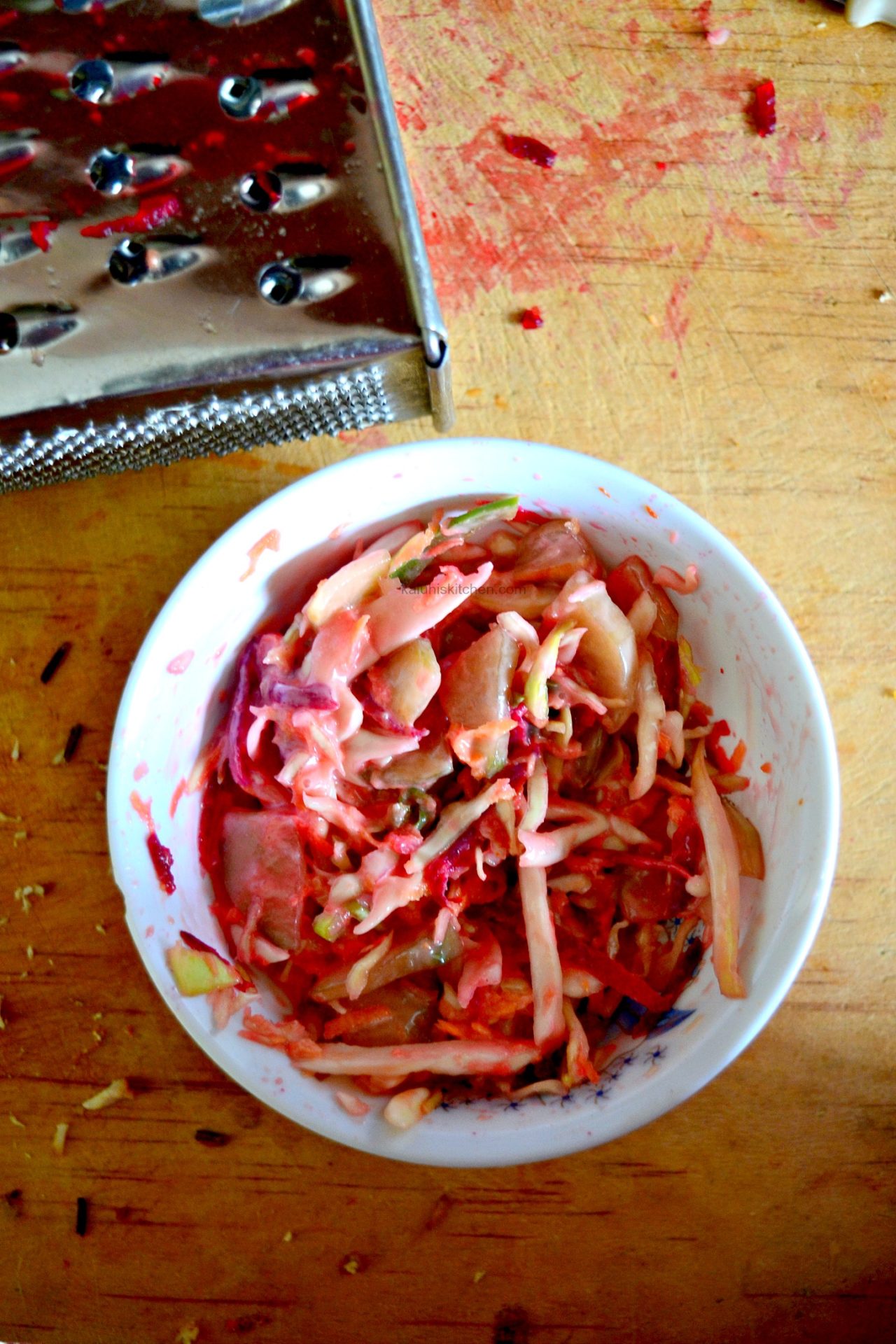 make your left over slaw alot more palatable by adding some fresh ginger and some beet for color and more flavor and nutrients