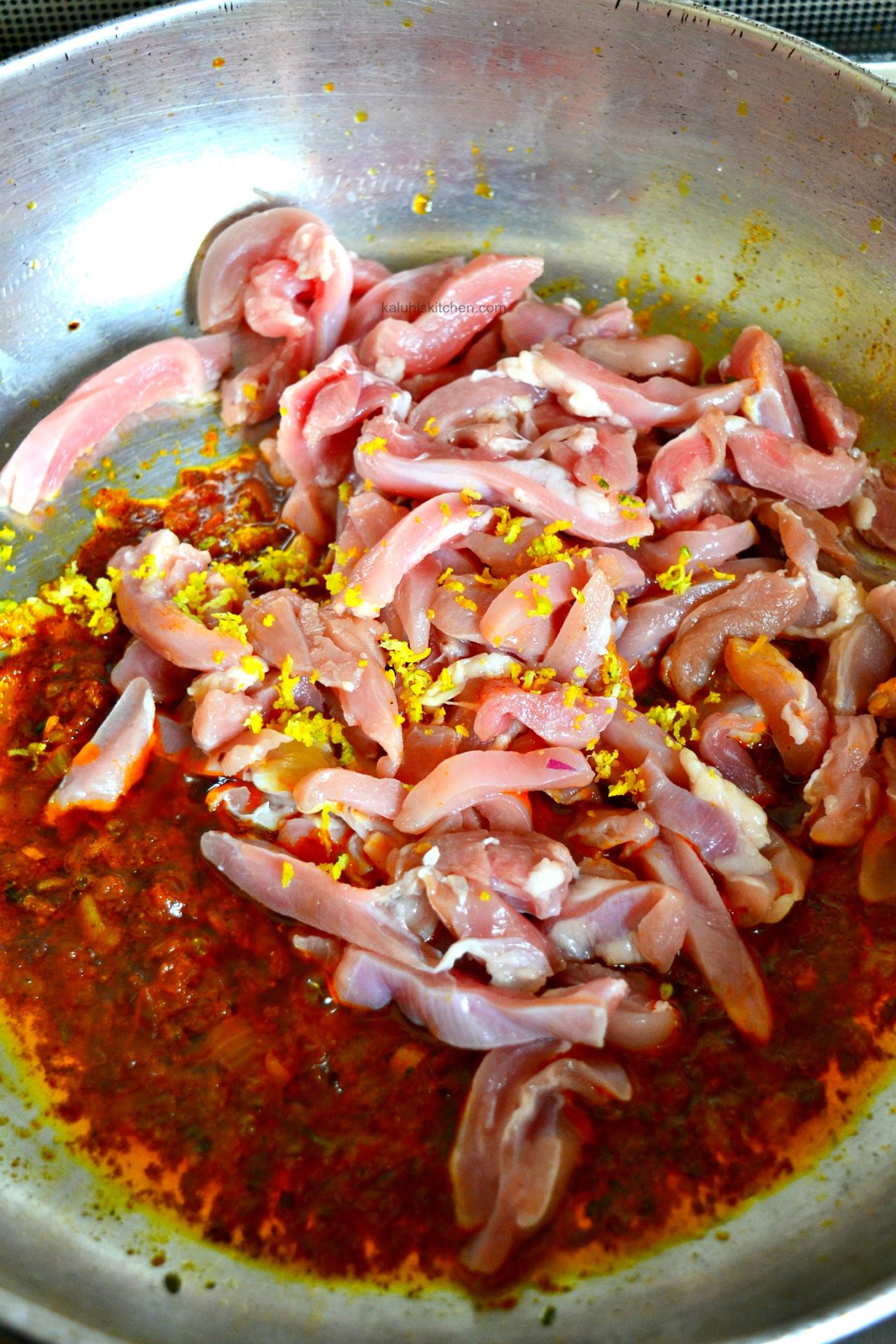 add the chicken strips together with the lemon zest, lemon juice and stir them on the sauce and let them cook down for 5-8 minutes-kaluhiskitchen.com