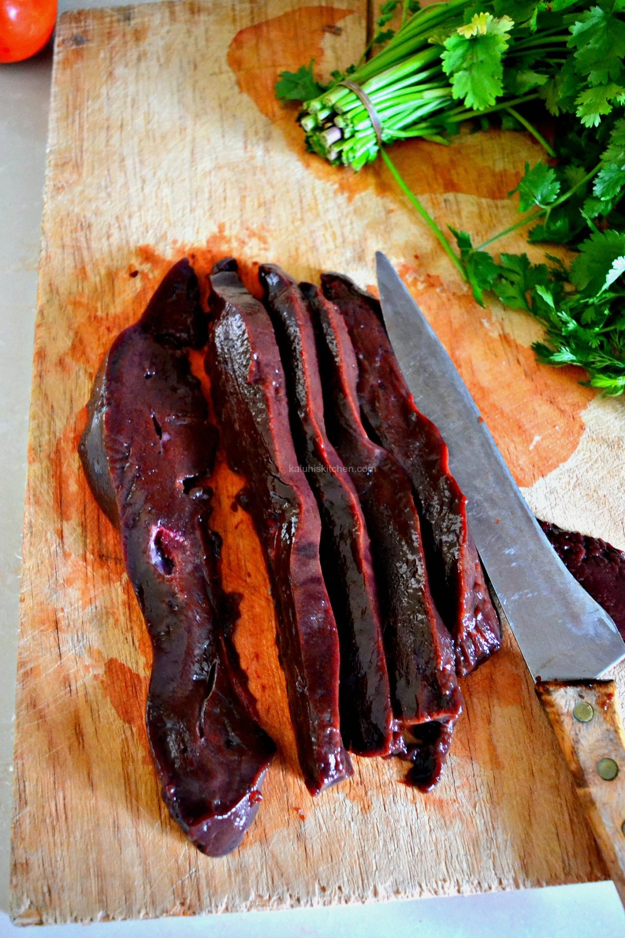 after removing the membrane off your liver itis now time to cut it into small neat cubes ahead of the cooking process_garlic paprika liver_kaluhiskitchen.com