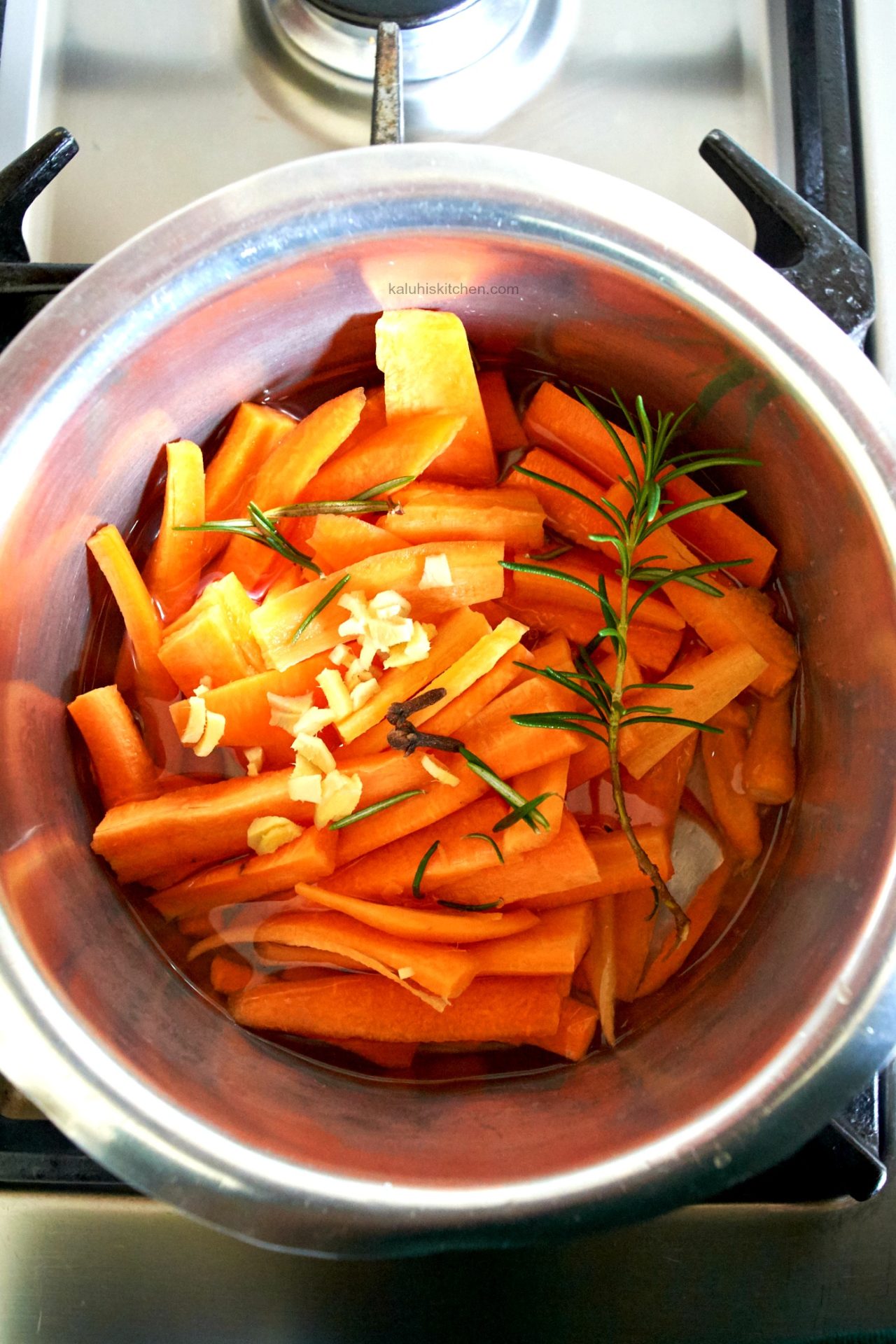 begin by boiling your carrots, karafuu, ginger and rosemary together until the carrots are completely soft_kaluhiskitchen.com