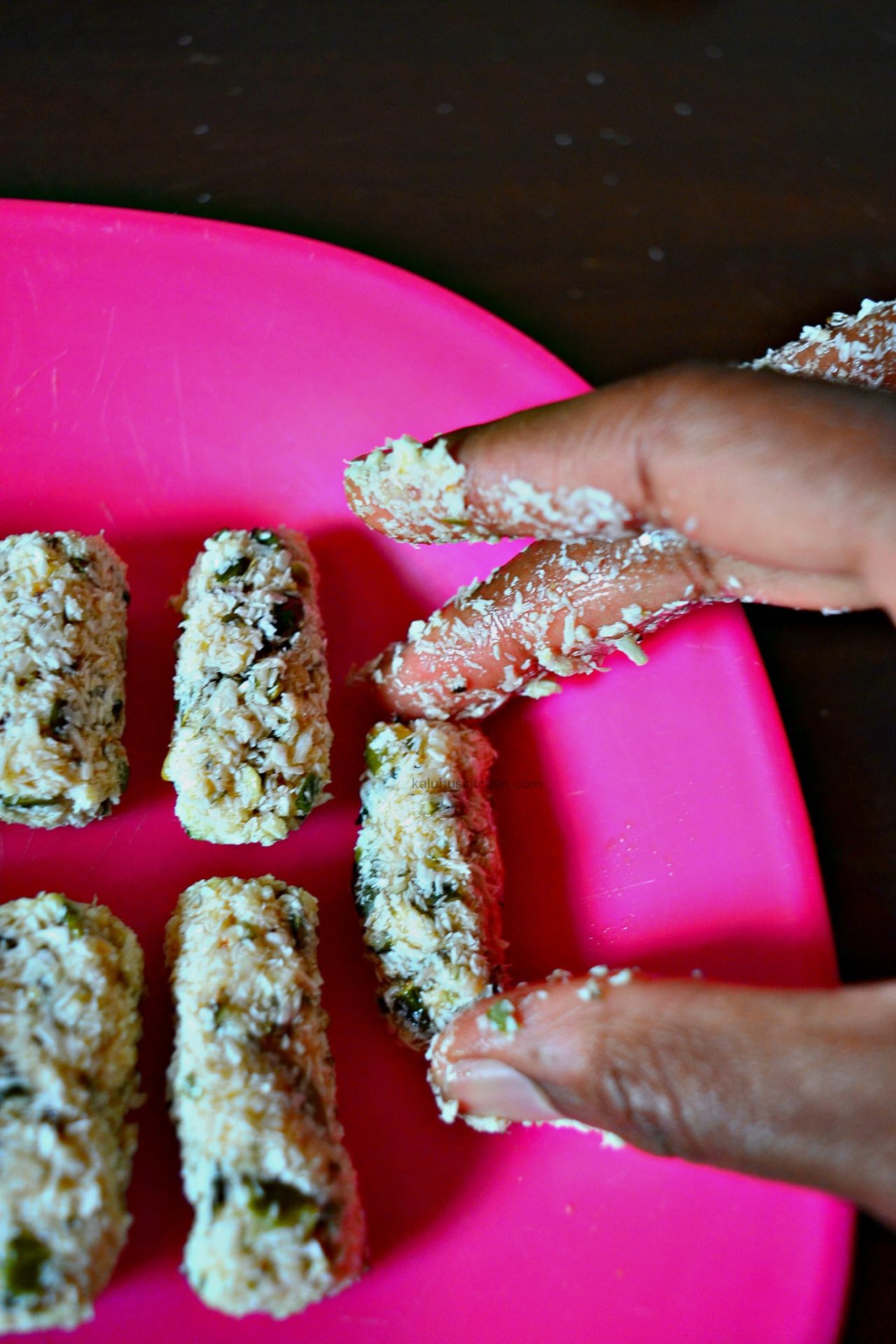 roll the truffles in to a cylindrical shape of a sphereand allow to rest for about 10 minutes in a freezer_kaluhiskitchen.com