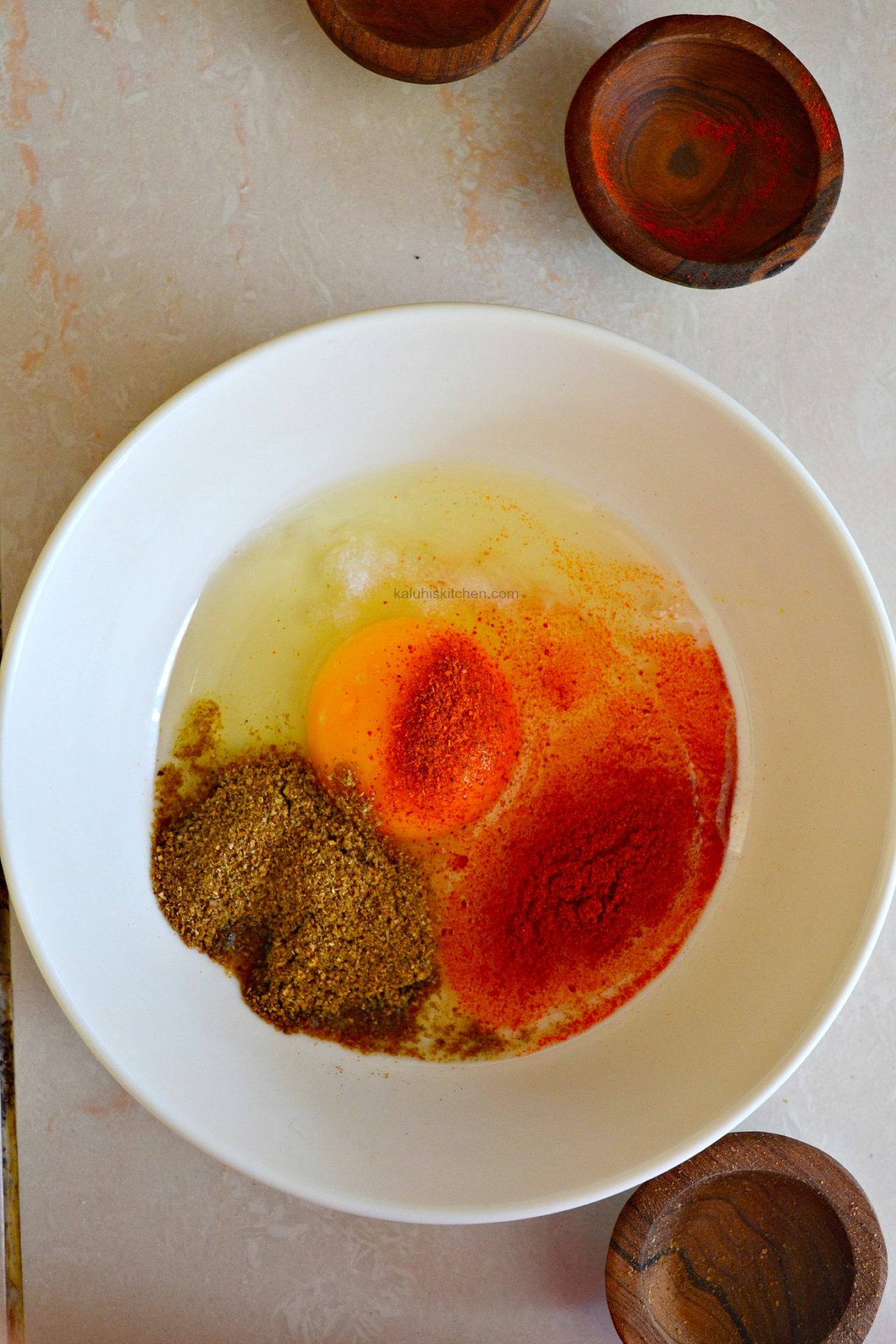whisk the eggs with some cayenne, coriander powder and paprika and salt to add both flavor and aroma_kaluhiskitchne.com
