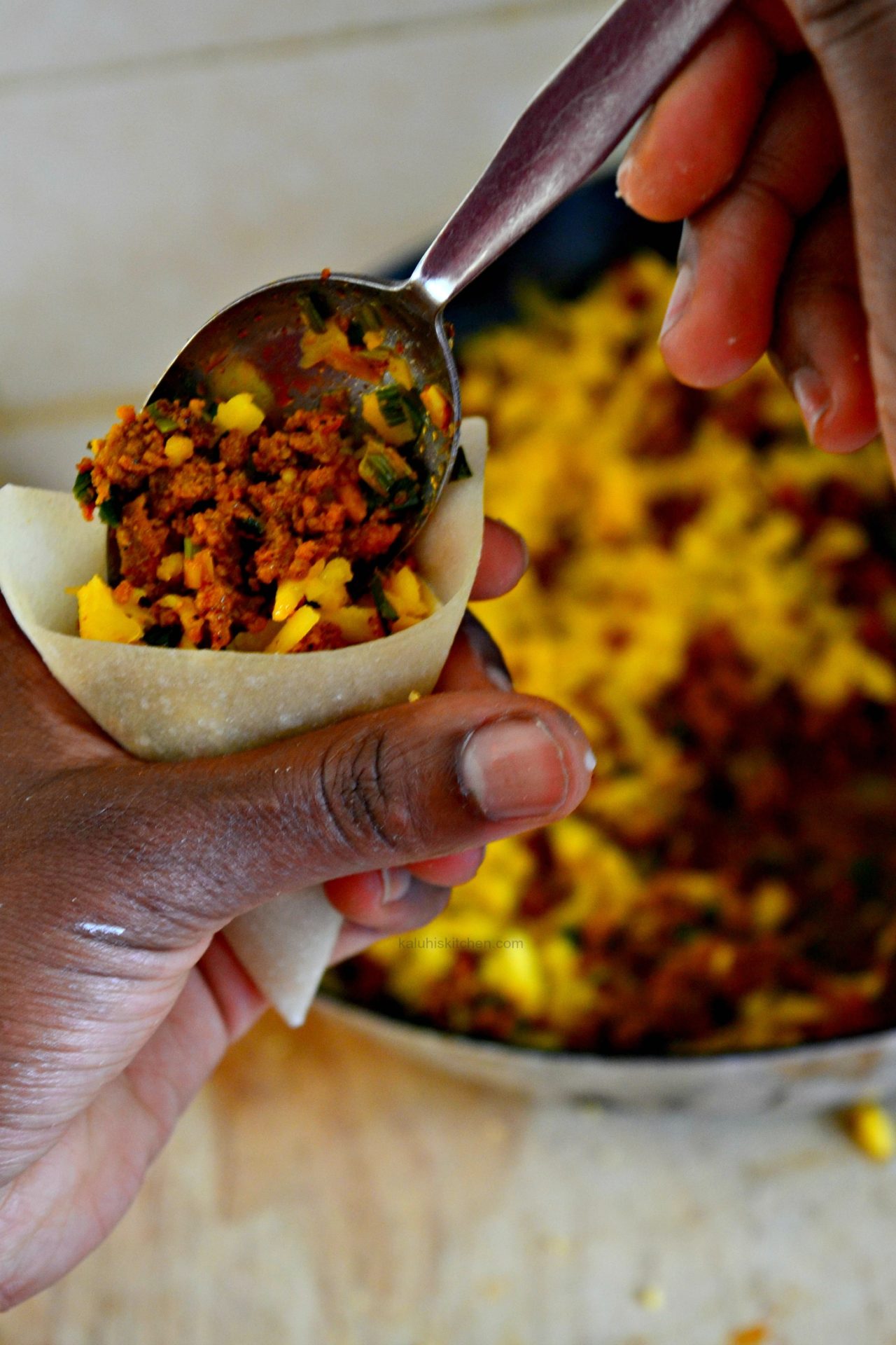 Fill the samosa pastry with the freshly prepared cheesy minced beef sautee laced with guinness and garnished with some cheese_kaluhiskitchen.com_