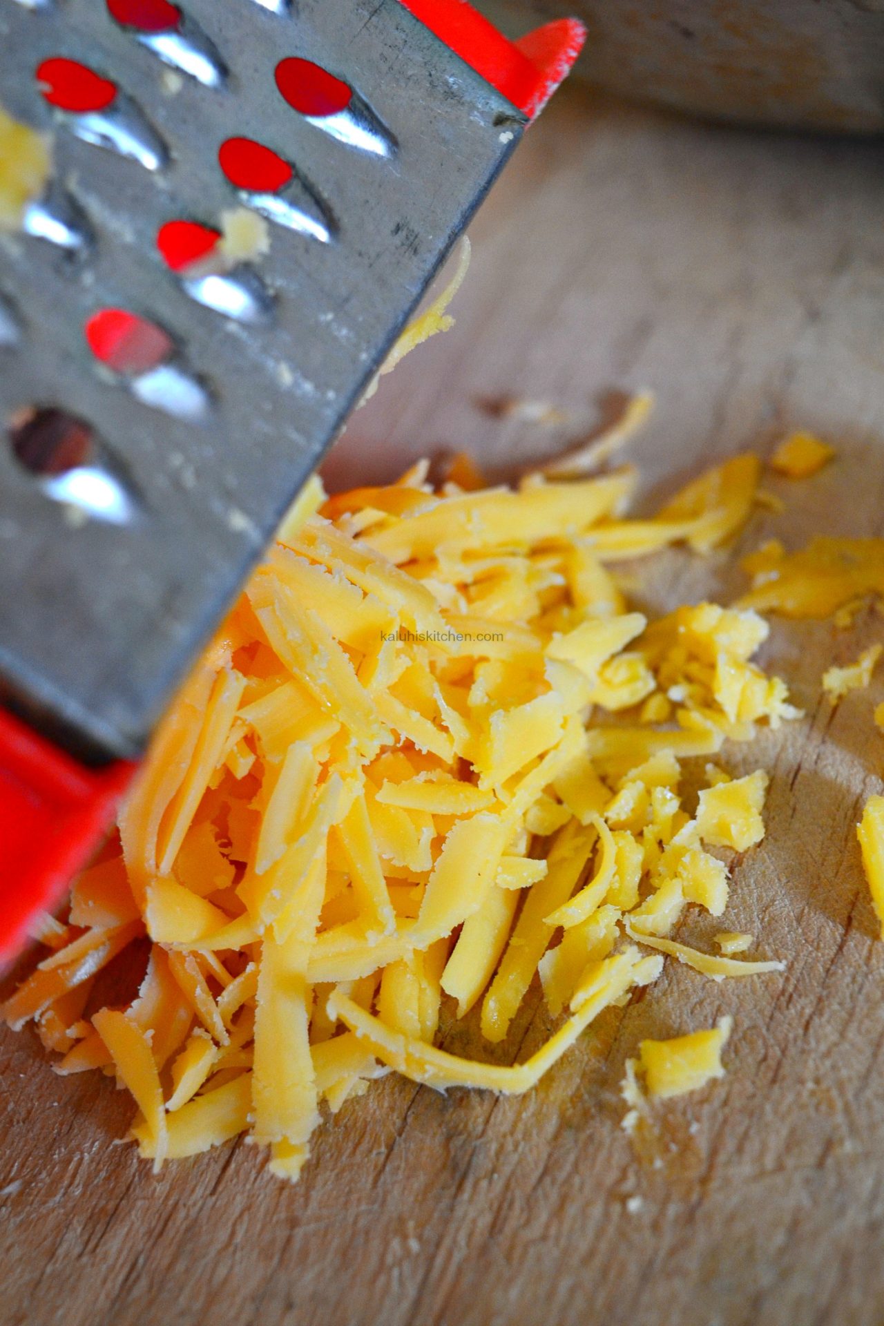 grate the cheddar cheese before adding it over the cooked beef so that it melts more readily in the samosa_kaluhiskitchen.com