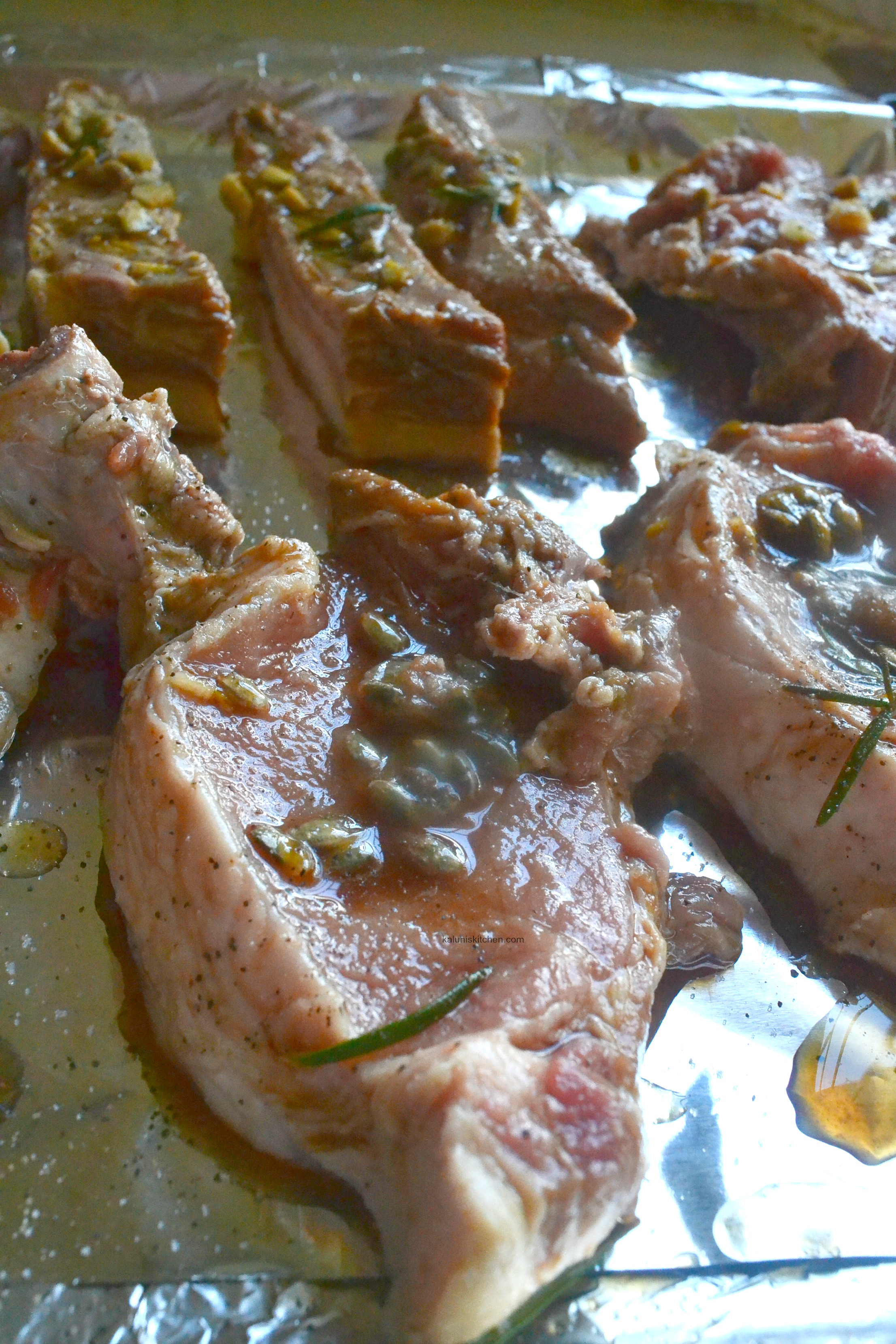 add-your-pork-chops-onto-a-baking-tray-lined-with-foil-paper-to-avoid-excessive-spalttering_how-to-cook-pork-chops_passion-fruit-marinated-honey-pork-chops_kaluhiskitchen-com