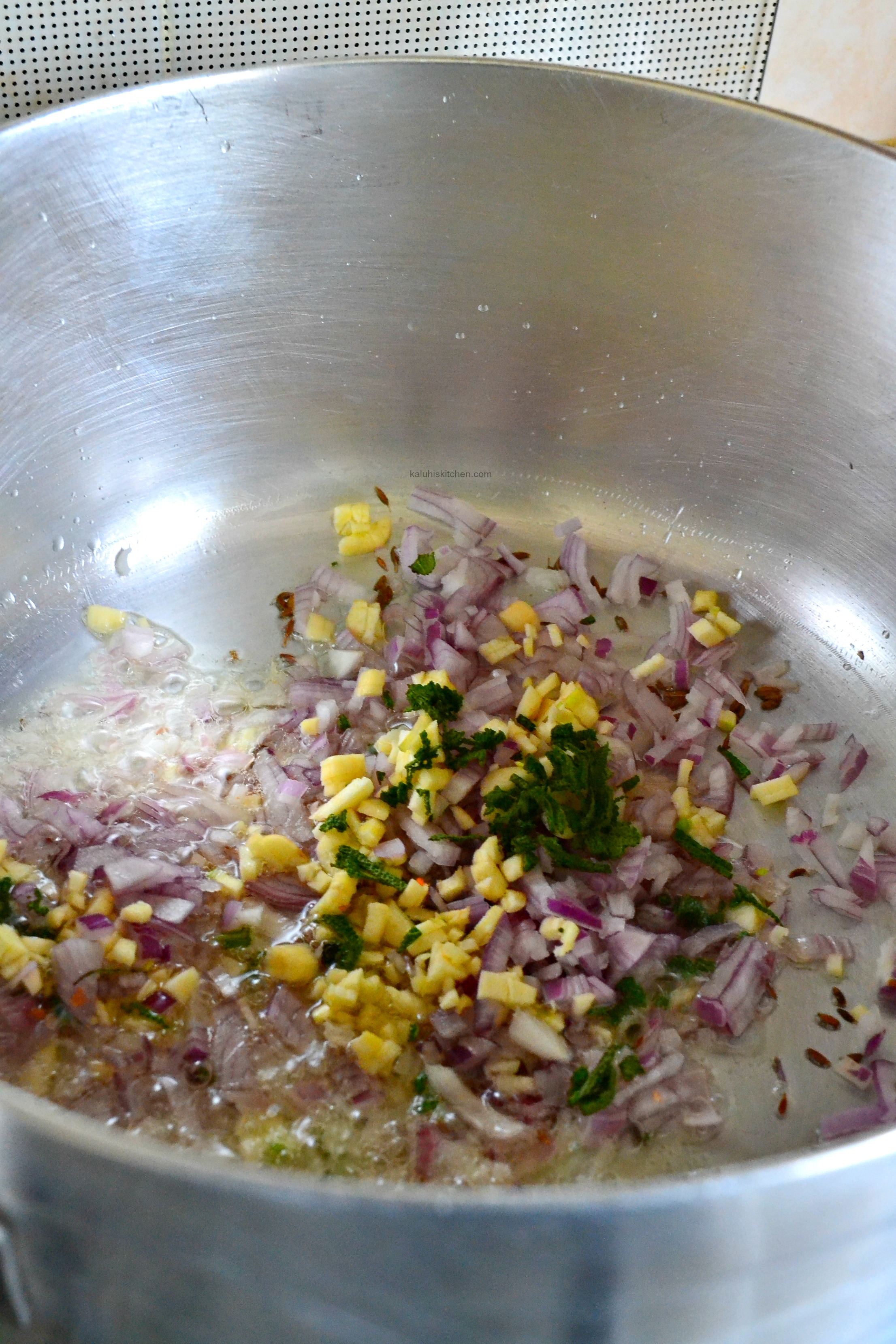 add-some-cumin-seeds-red-onion-sage-and-finely-chipped-garlic-to-cook-until-fragrant_how-to-make-njahi_best-njahi-recipes_kaluhiskitchen-com