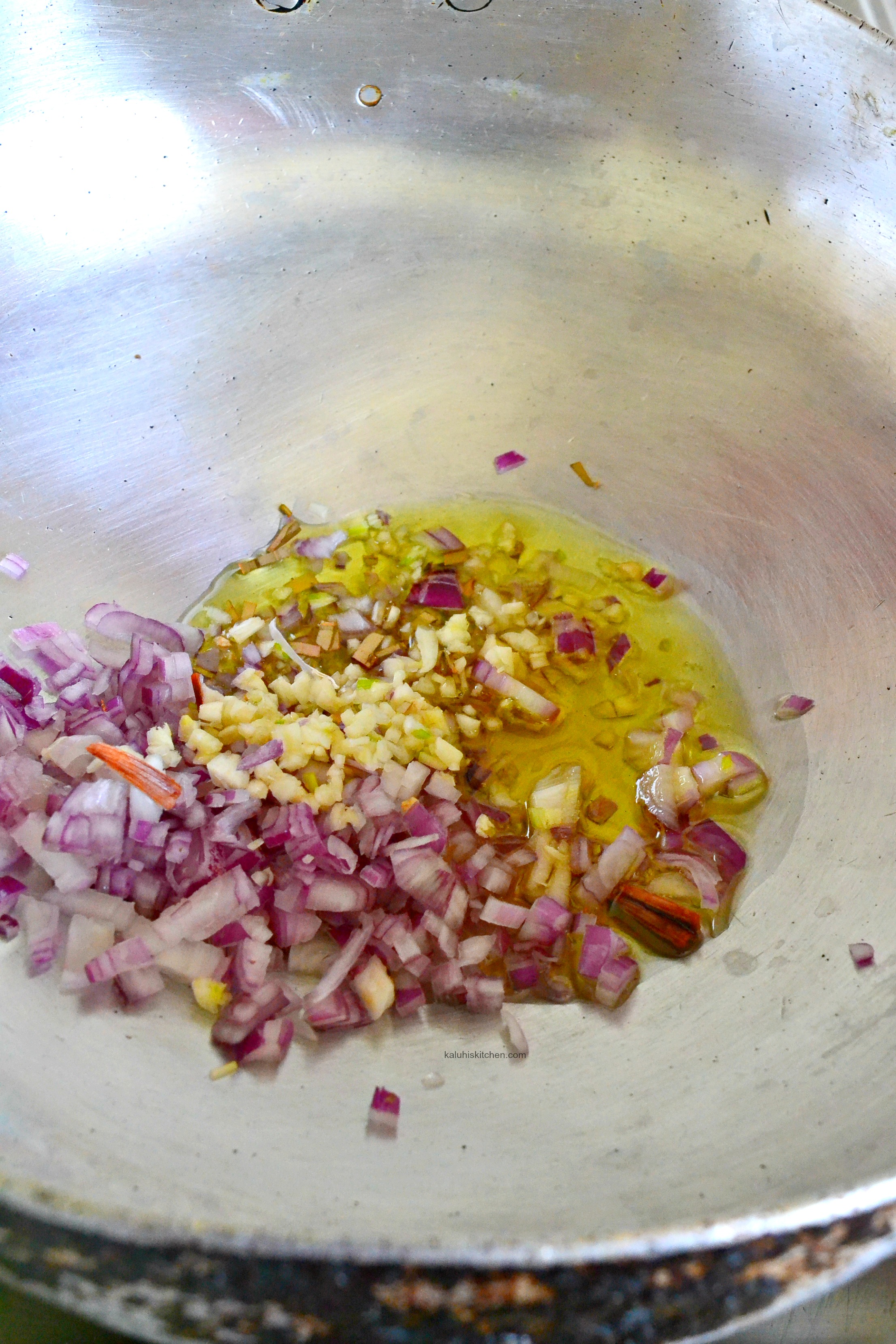 fry-the-onions-with-some-garlic-red-onion-and-bay-leaves-so-that-all-the-flavors-of-the-marinade-get-tied-into-the-stewing_kaluhiskitchen-com